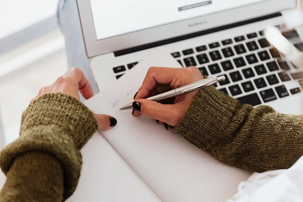 Woman writing check-list